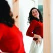Young,Beautiful,Self,Confident,Woman,In,Red,Sweater,Looking,In